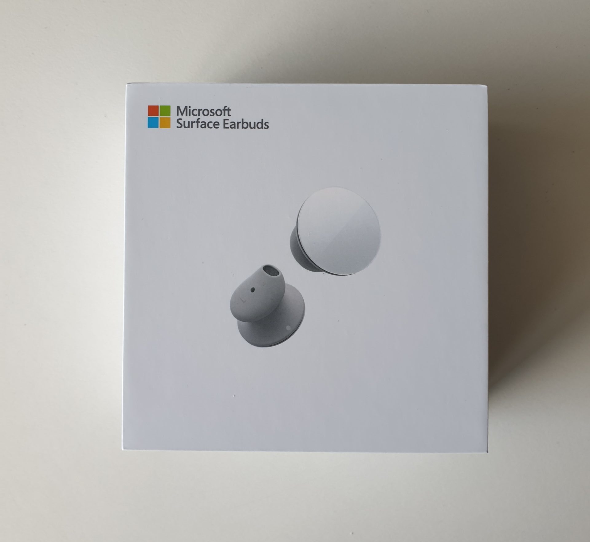 The Surface Earbuds and the charging case